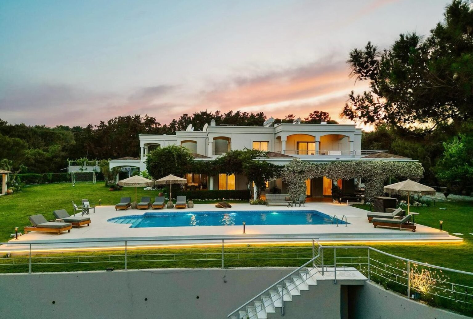 Lounge area outside Bello Blu in Greece, with modern outdoor furniture and views of the Mediterranean Sea.