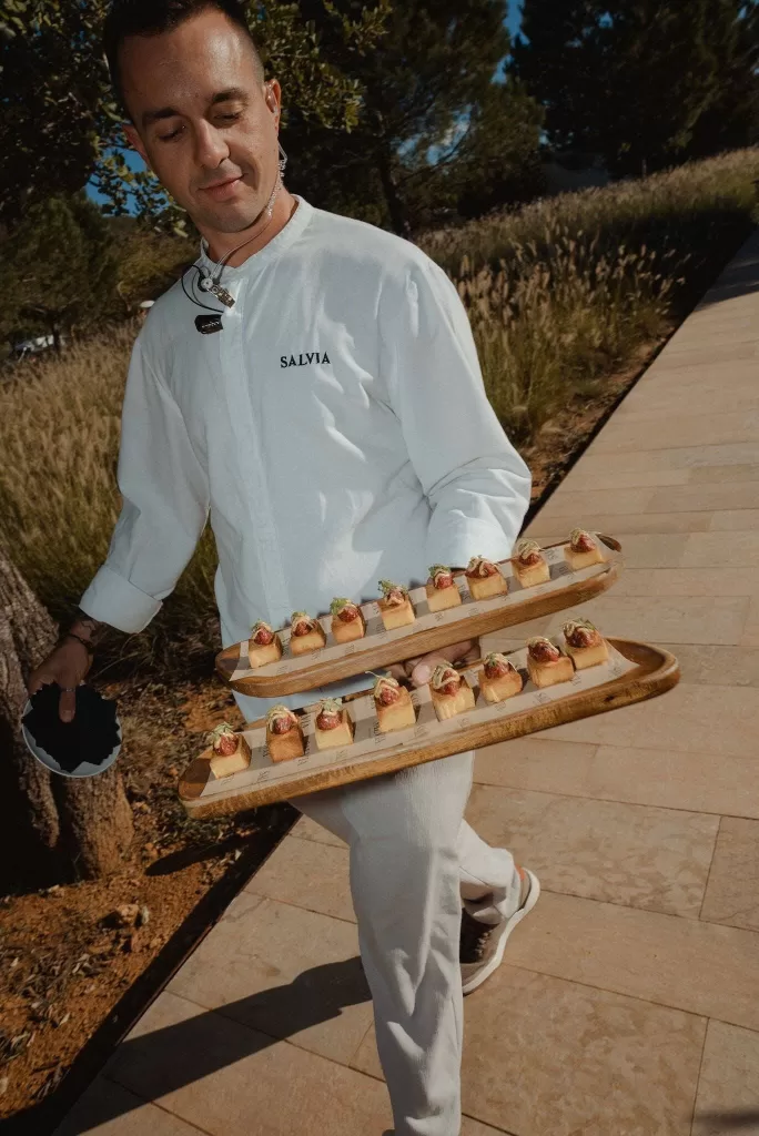 Wedding canapés served by Salvia catering at Ca Na Xica, presented beautifully on wooden trays.