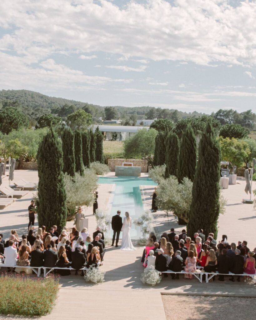 Romantic outdoor wedding ceremony with sunlit Ibiza landscapes at Ca Na Xica