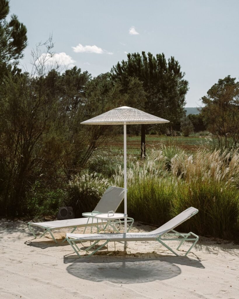Stylish sun loungers by the pool at Ca Na Xica, the perfect wedding retreat in Ibiza.