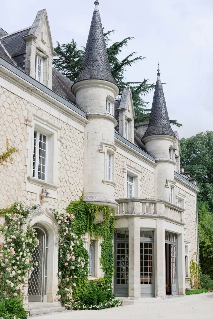 Architectural close-up of the slate turrets and stone detail at Château de la Couronne.