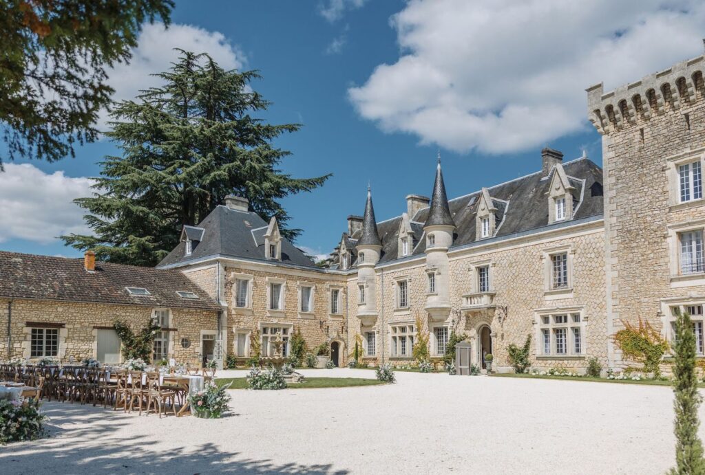 The majestic facade of Chateau de la Couronne, a luxurious wedding venue in the French countryside.