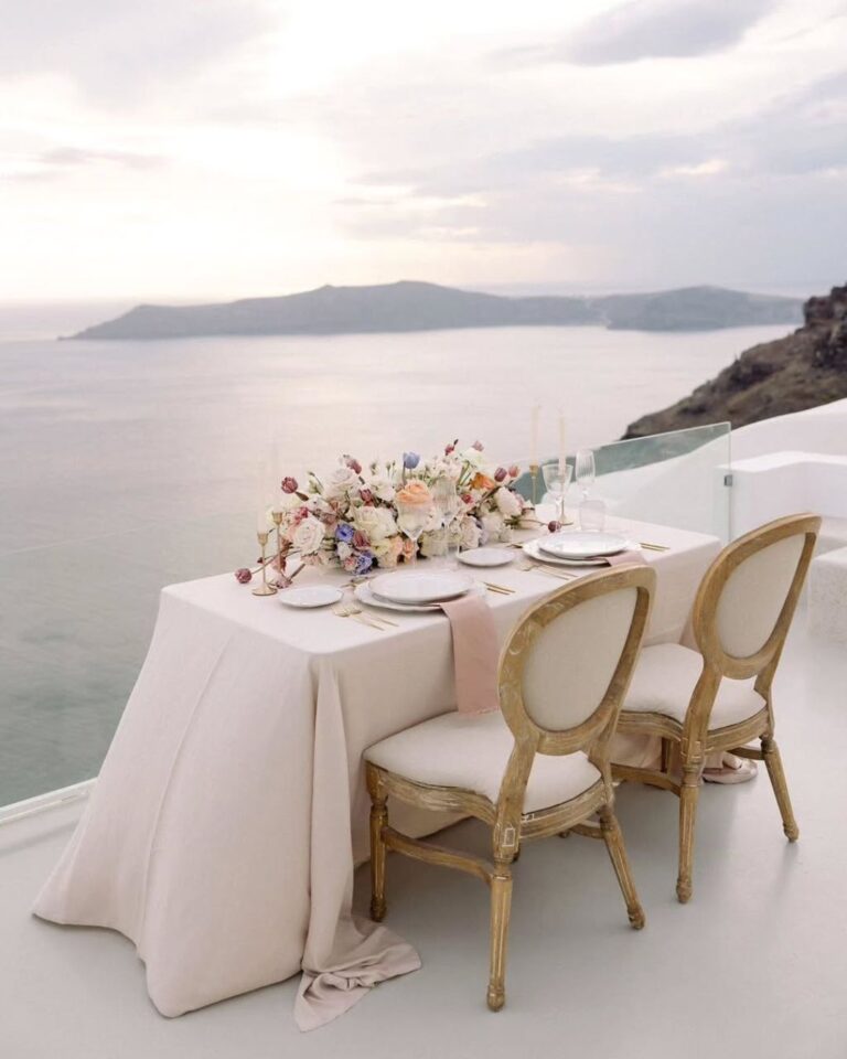 Elegant elopement dinner table setup with panoramic Santorini views at Cocoon Suites