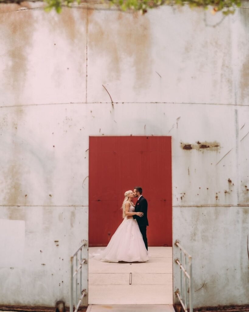 Intimate wedding ceremony setup at Dexamenes Seaside Hotel in Greece, with an elegant arch and beach backdrop.