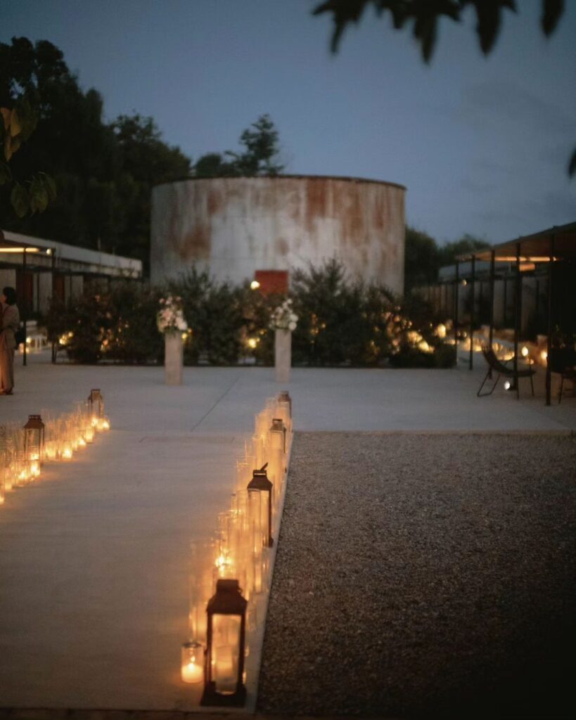 Candlelit wedding reception tablescape at Dexamenes Seaside Hotel in Greece, creating a romantic atmosphere by the sea.