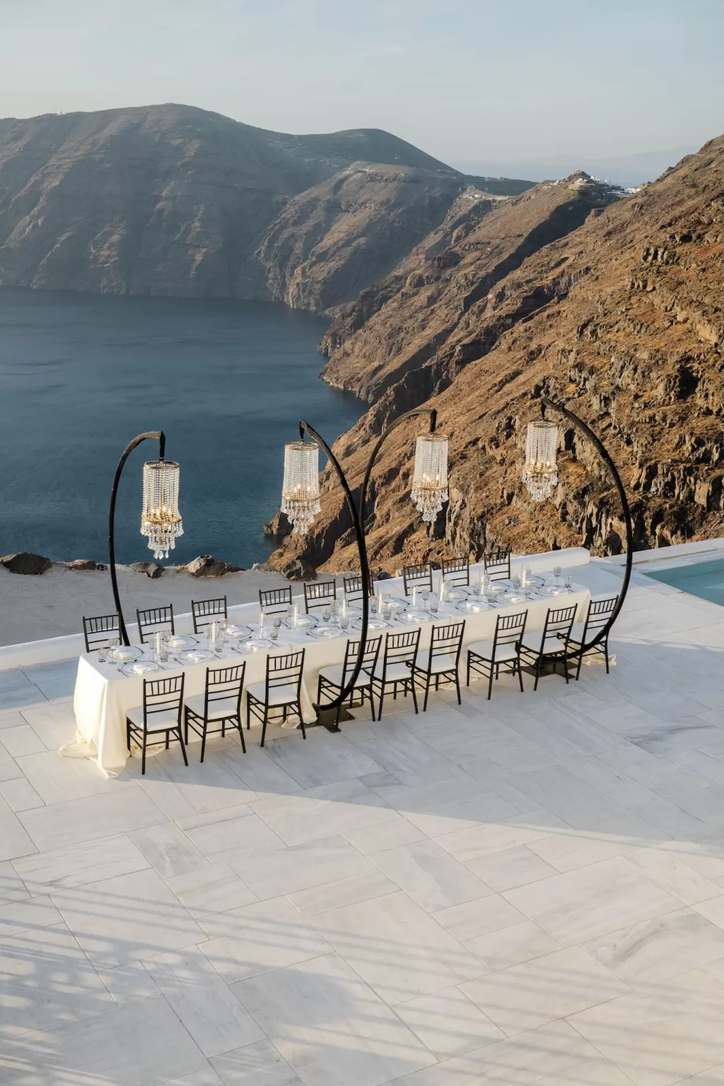 Cliffside wedding dining setup with ocean views at Rocabella Santorini