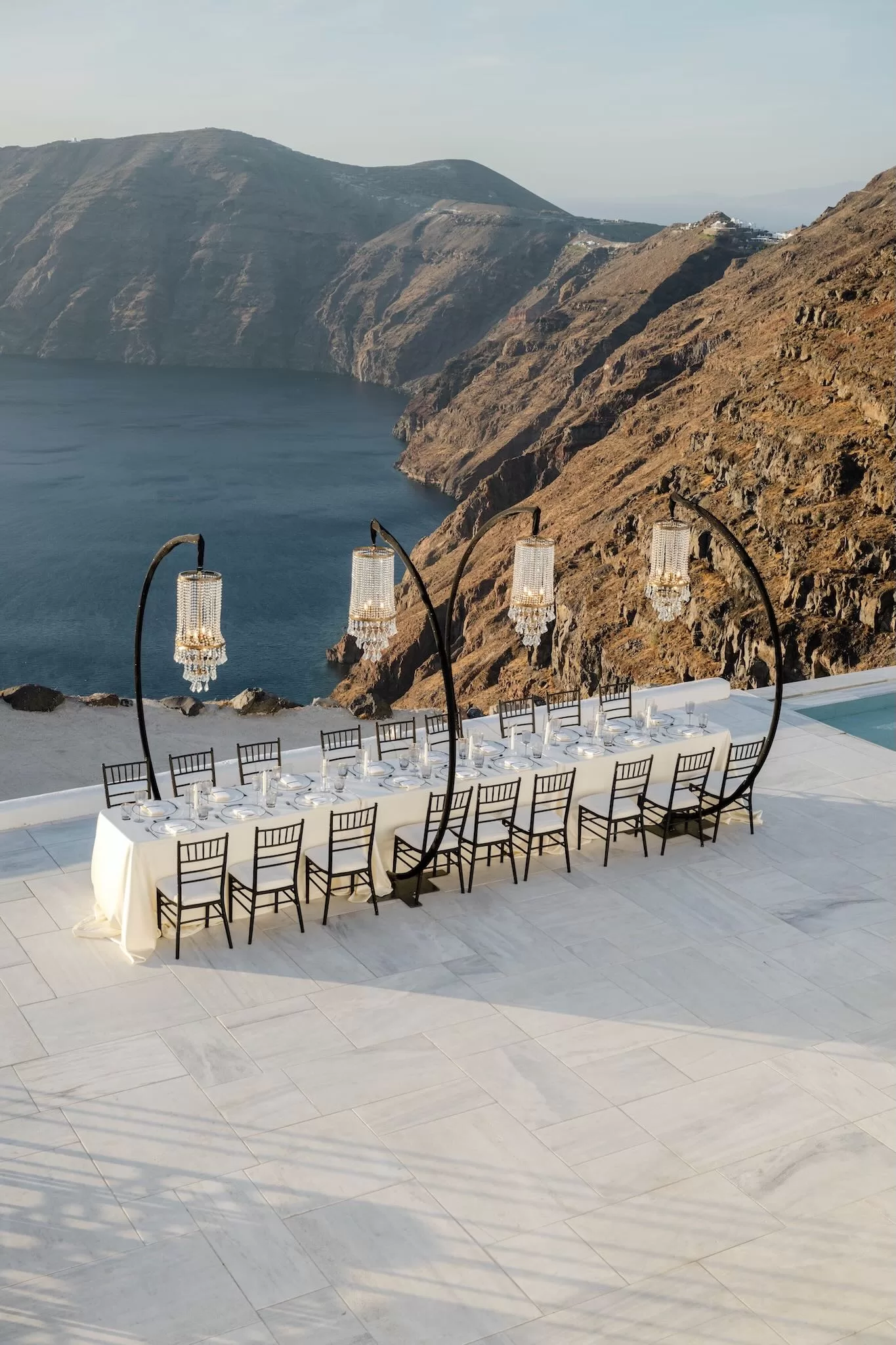 Cliffside wedding dining setup with ocean views at Rocabella Santorini
