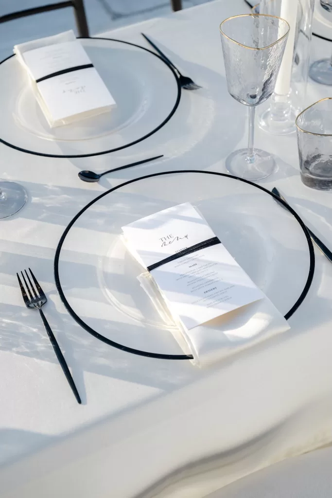 Elegant outdoor table setting with white florals at Rocabella Santorini