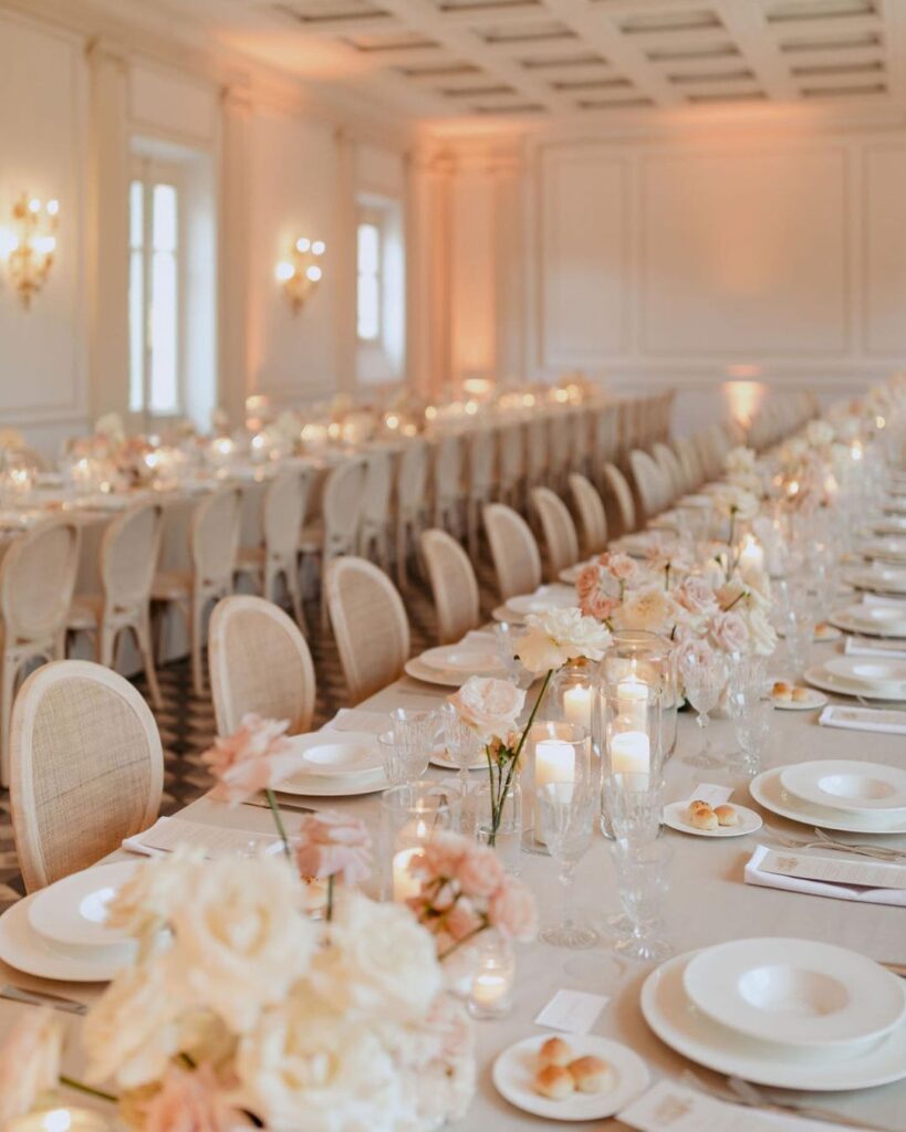 A luxurious tablescape in Villa Aurelia’s ballroom, set with fine china and floral accents, captured by Paola Colleoni