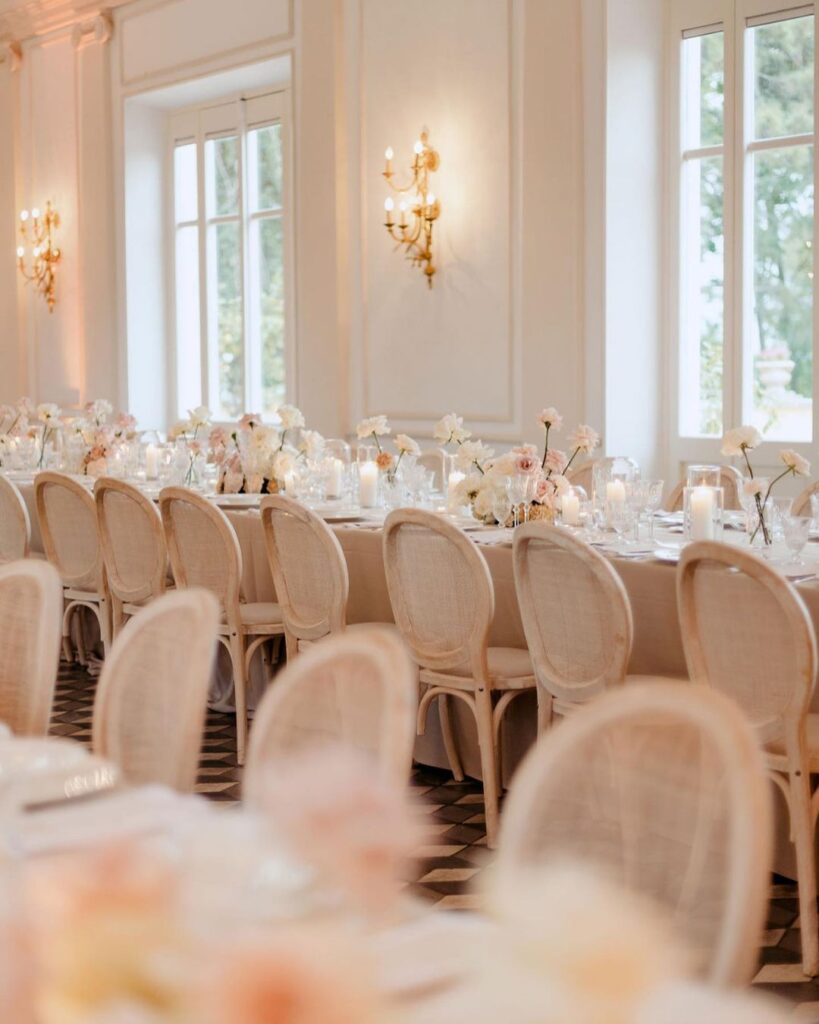 A wedding reception at Villa Aurelia, with fairy lights creating a romantic evening setting, captured by Paola Colleoni.