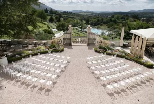 Elevated ceremony view showing symmetrical seating and lush countryside at Villa Cariola.