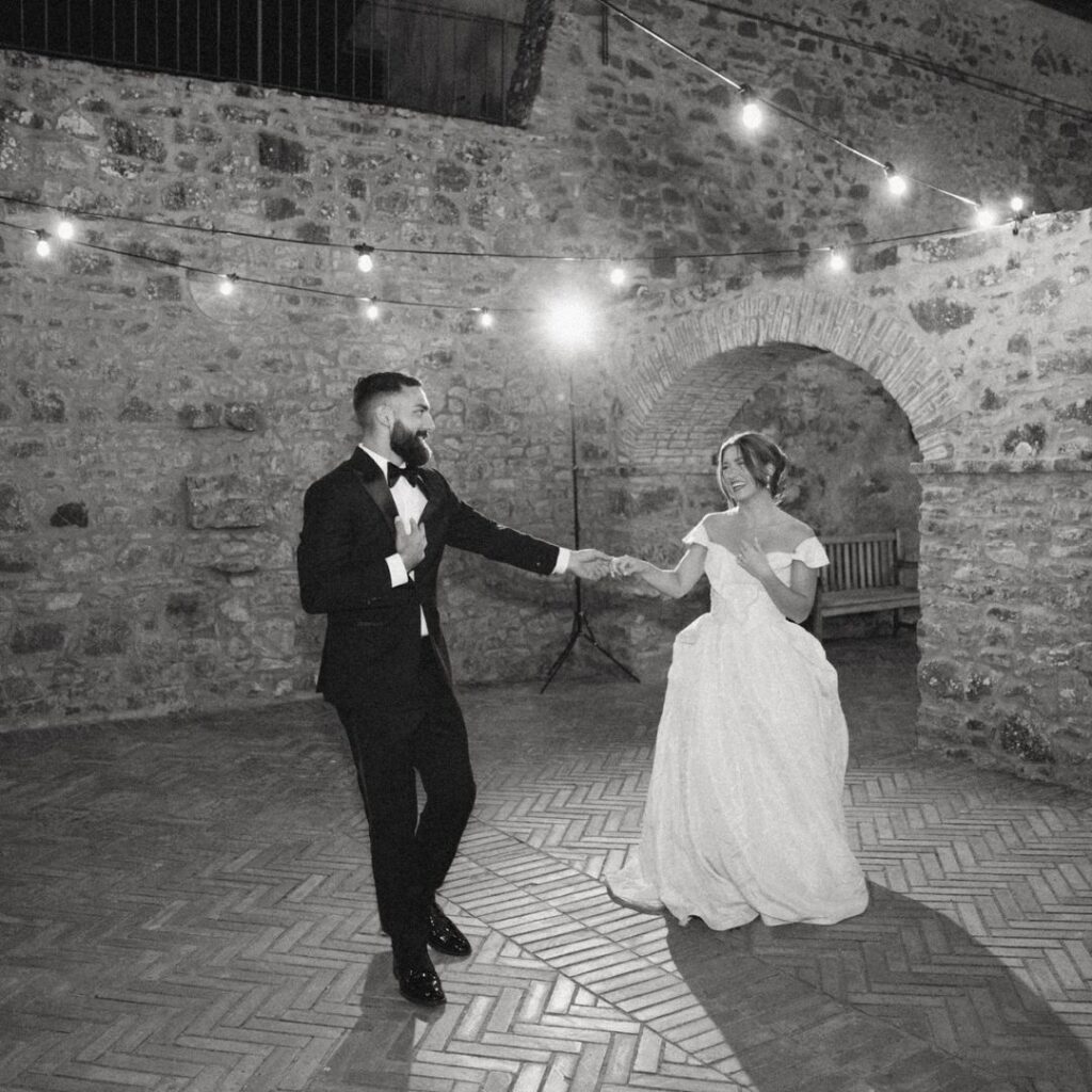 Guests dancing under the stars at a magical Antico Convento wedding celebration.