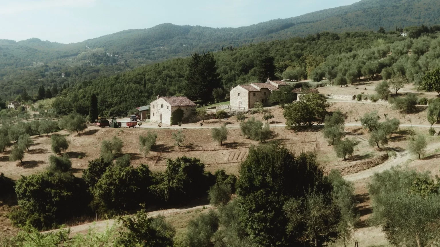 Panoramic view of Tuscan countryside and farmhouses surrounding Castello del Trebbio.