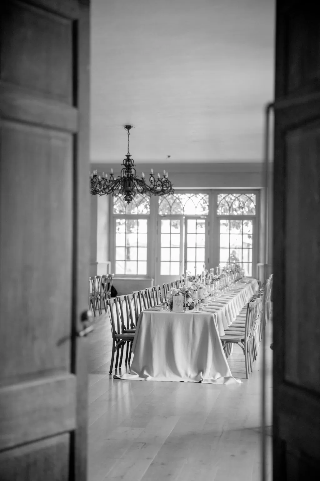 The couple shares a quiet embrace on a velvet settee in Euridge Manor’s stone corridor, away from the celebration.