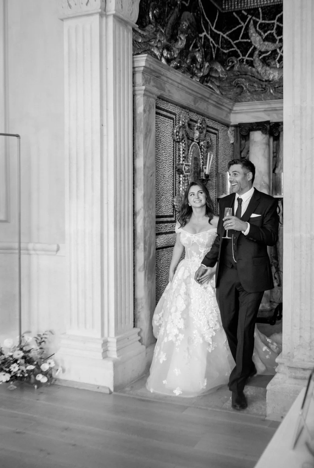 Just married, the couple enters the reception space at Euridge Manor, beaming with joy.