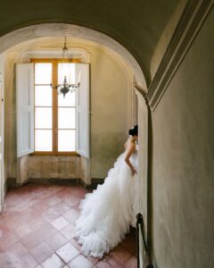 Captivating bridal portrait taken in the scenic gardens of Villa di Geggiano, showcasing timeless beauty, captured by Liza Litvinovich.