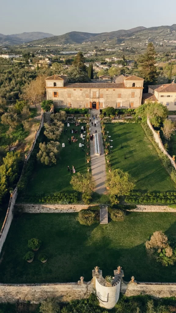 Breathtaking aerial view of Villa Medicea di Lilliano, its walled gardens and the surrounding Tuscan landscape.