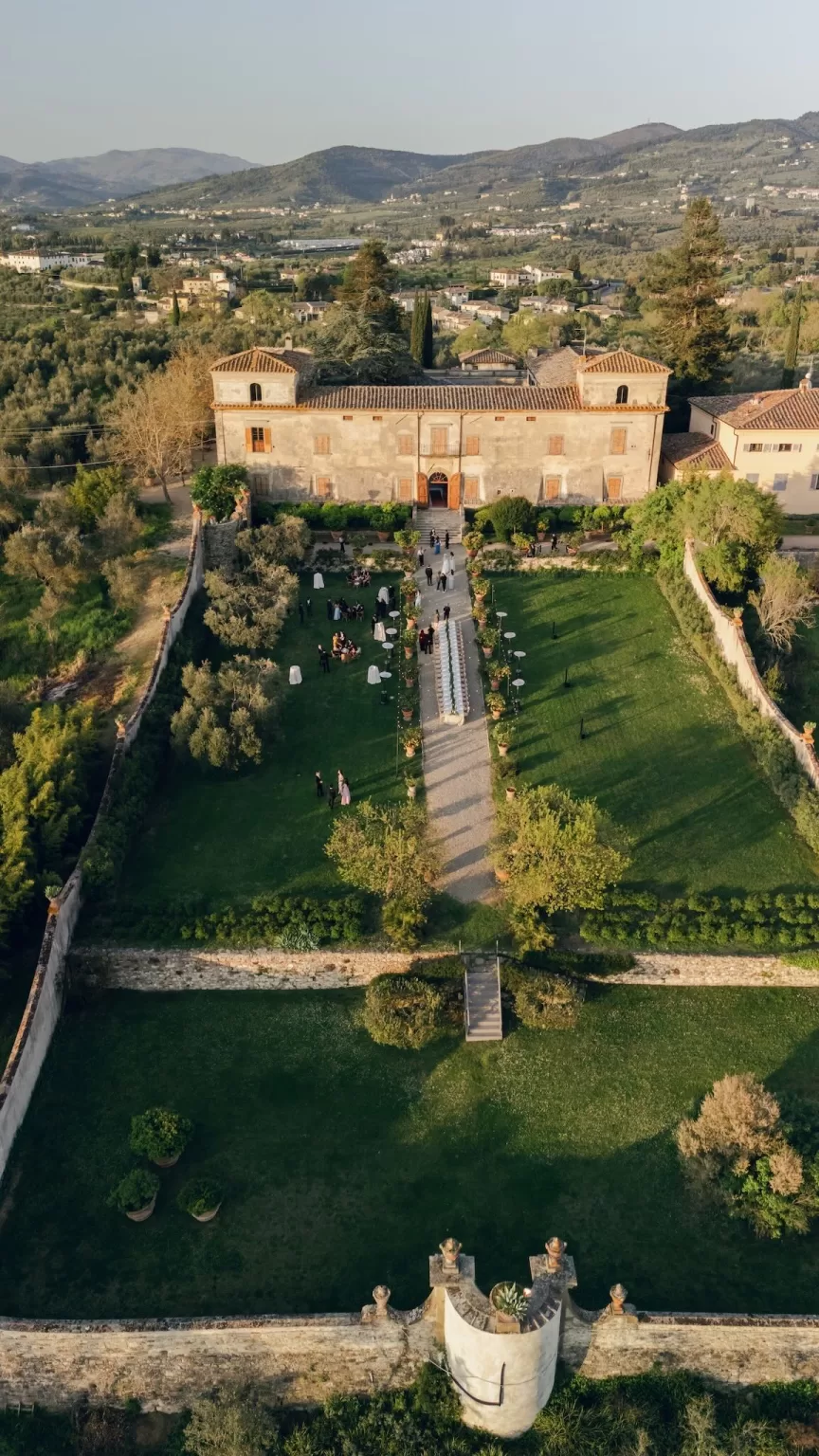 Breathtaking aerial view of Villa Medicea di Lilliano, its walled gardens and the surrounding Tuscan landscape.