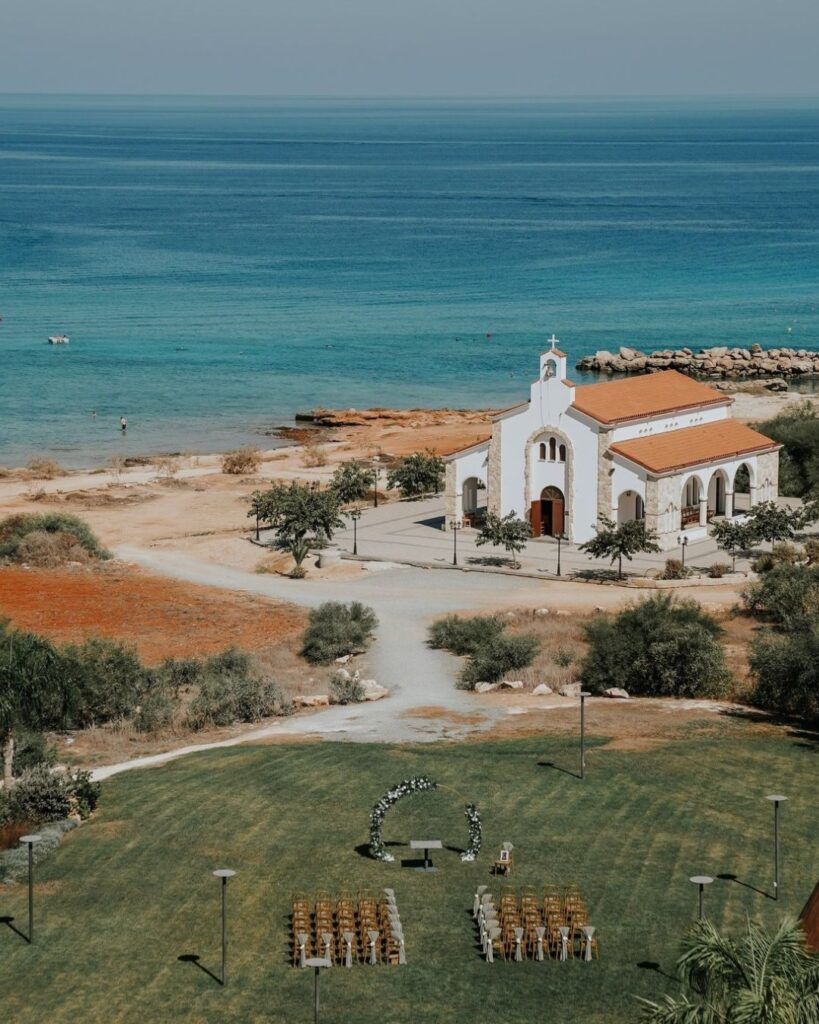 The beautiful outdoor ceremony setup at Cavo Zoe, overlooking the sea, captured by Sasha Grishina