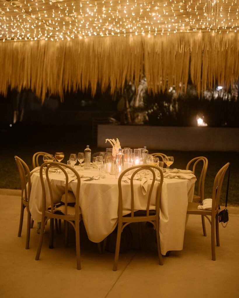 A beautifully arranged wedding table setup at Cavo Zoe, with elegant decor and ocean views, photographed by Karina Leonenko