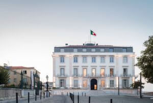 Stunning front view of Verride Palácio Santa Catarina in Lisbon, Portugal, with historic architectural elegance and lush greenery.