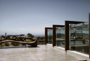 Areias do Seixo at dusk, its modern architecture blending seamlessly with the surrounding coastal landscape.