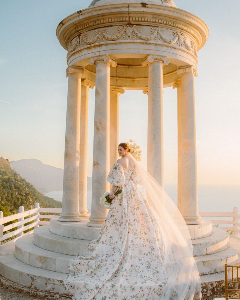 Bride posing gracefully during sunset, with warm golden light casting a beautiful glow on her.