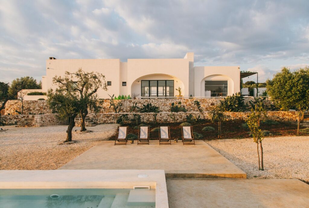 A serene terrace lounge at Masseria Morosetta, offering views of the surrounding olive groves, captured by Salva Lopez.