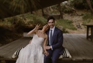 The couple walking together just after their ceremony at Areias do Seixo, filled with joy and excitement.