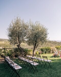 Rows of ceremony chairs facing a stunning countryside backdrop at Quercia al Poggio.
