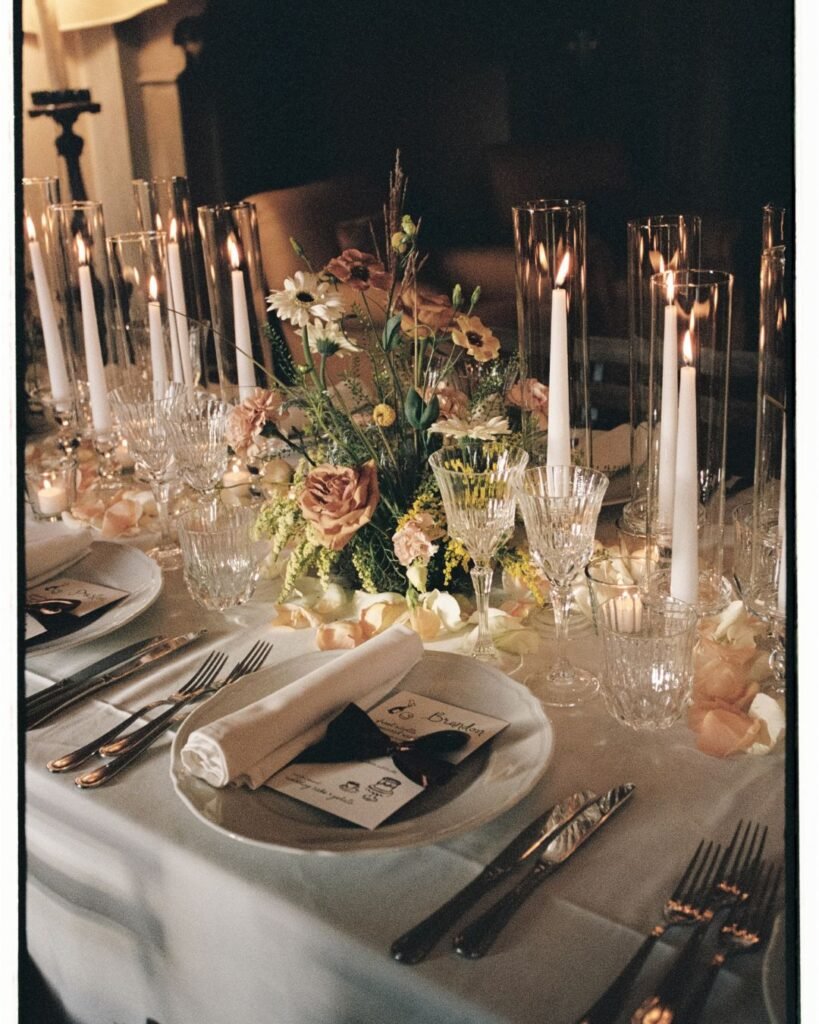 Elegant tablescape details at Villa Lungomonte, featuring delicate florals, candlelight, and fine tableware.
