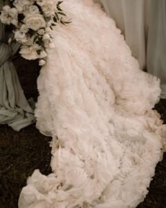 A close-up of the bride holding a lush bouquet at Villa Donna Camilla, highlighting delicate florals.