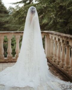 The bride gracefully descends the stone staircase of Villa Donna Camilla, exuding elegance.