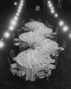 A warm and inviting reception setup at Villa Donna Camilla, with flickering candlelight and rustic charm.