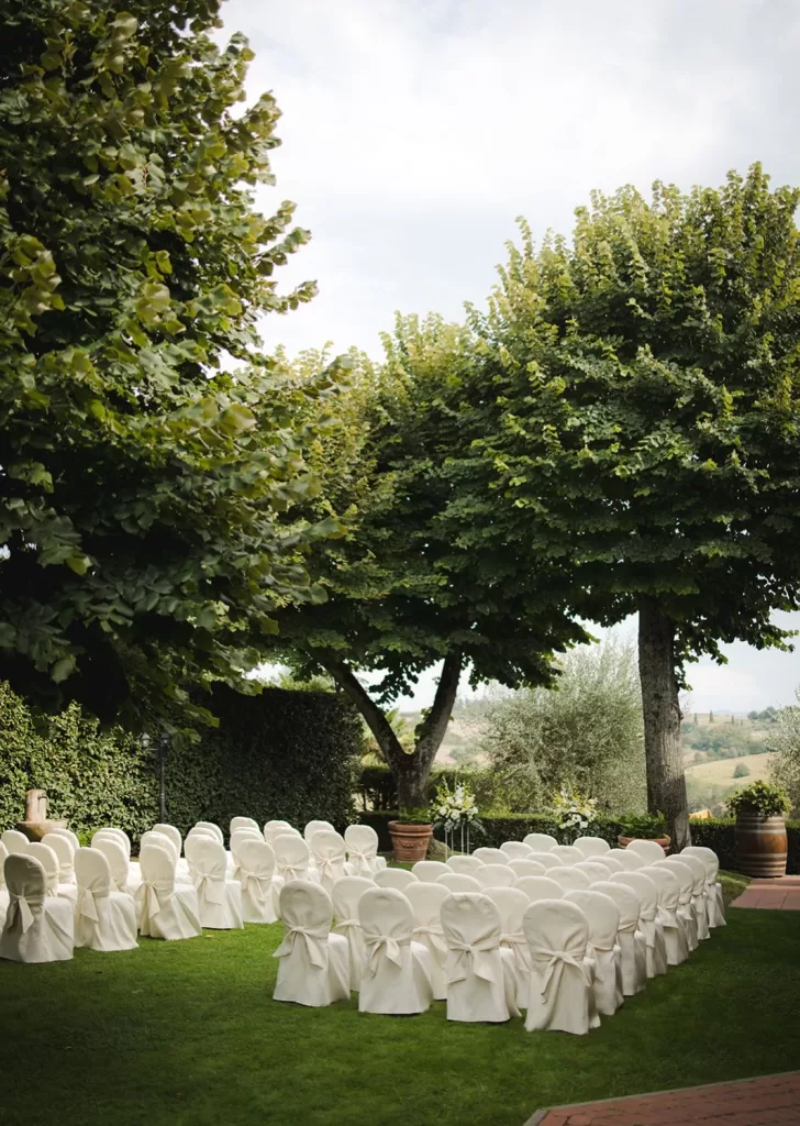 Peaceful ceremony garden with views of the Tuscan hills at Borgo Tre Rose.