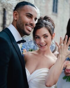 Newlywed bride showing off her engagement ring beside the groom, moments after their ceremony at Castello Montignano.
