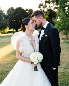 Bride and groom share an intimate moment during romantic golden hour portraits at Domaine d'Essendiéras.