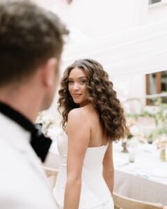 Bride exchanging an affectionate, romantic glance with groom during their wedding celebration at Finca Morneta.