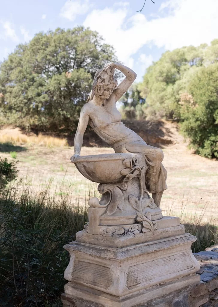 Elegant stone statue in the Mediterranean gardens of Mas Torroella wedding venue