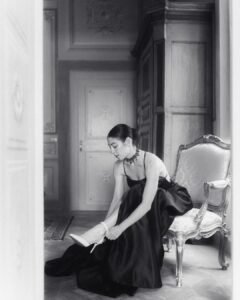 Bride fastening her heels in a luxurious black gown inside Villa Ivana’s ornate bridal suite.