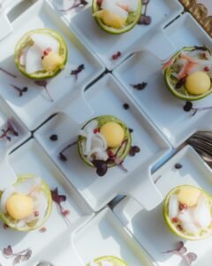 Creative lime cup canapés served on modern square plates at Villa Ivana wedding reception.