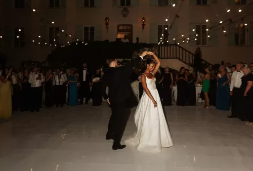 Romantic first dance moment for the couple at Bastide du Roy, with twinkling lights illuminating the night.