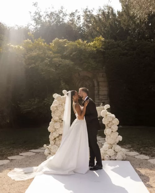 Bride and groom share a quiet, intimate moment in the gardens of Bastide du Roy, surrounded by nature