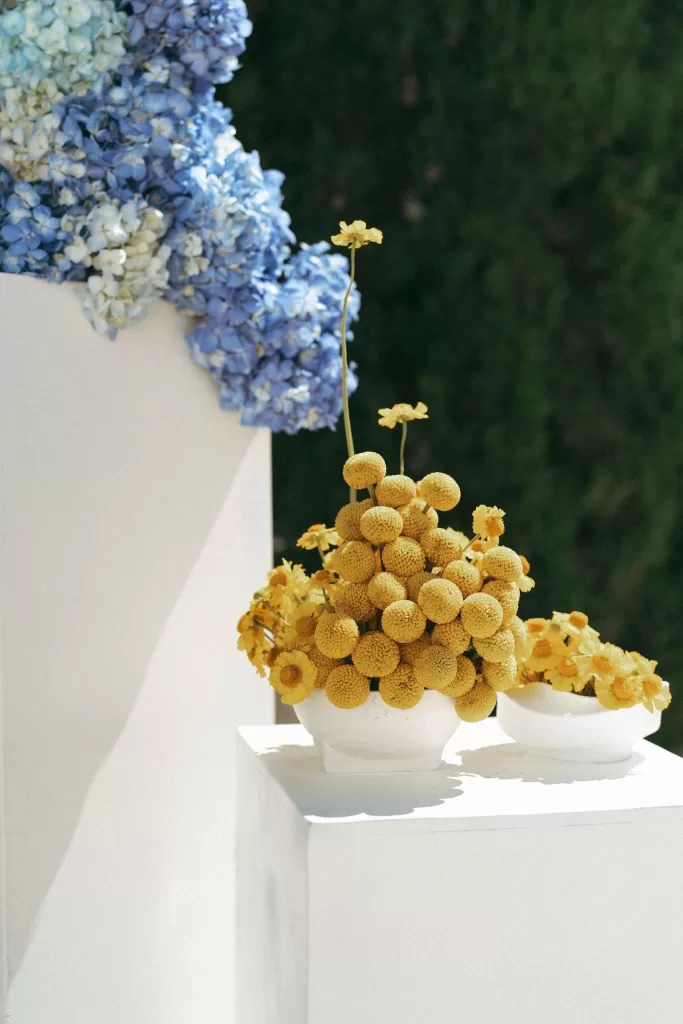 Floral pillars framing the outdoor ceremony space at Casa Sacoto