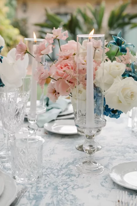 Elegant table decor with pastel florals and candlelight at Tenuta Corbinaia wedding reception.