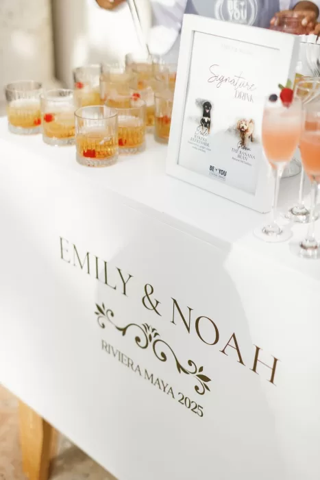 Signature drinks on display at Villa La Joya wedding with personalized cocktail sign.