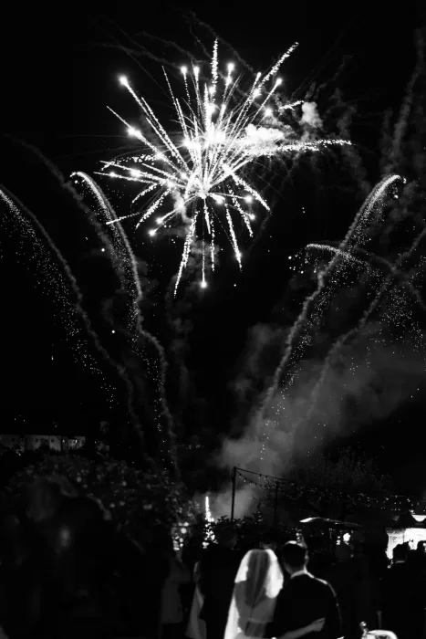 Bride and groom watching a magical fireworks display at night at Villa Medicea di Lilliano.