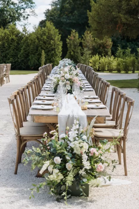 Refined place setting with oyster shell name card and printed menu at Château de la Couronne wedding.