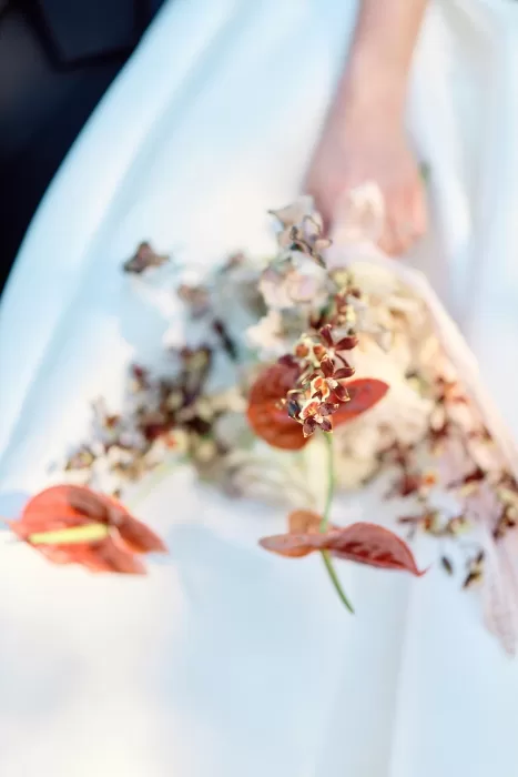 Modern bridal bouquet with orchids and anthuriums at Chateau de Sanse.