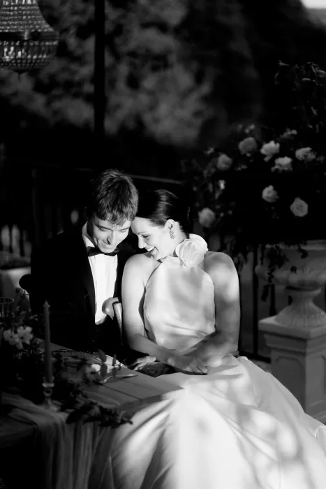 Romantic black and white photo of newlyweds sharing an intimate moment at Chateau de Sanse.